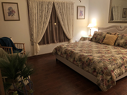 Looking into the bedroom suite from the living area.