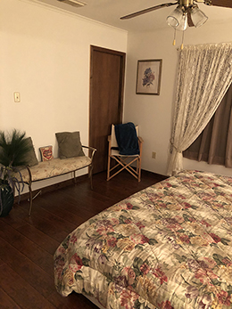 Ceiling fans are in both the bedroom and living area.